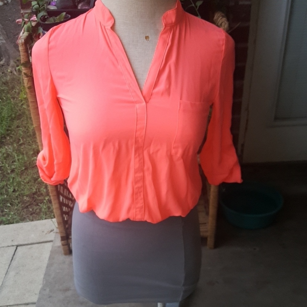 The grey skirt and pink long sleeve